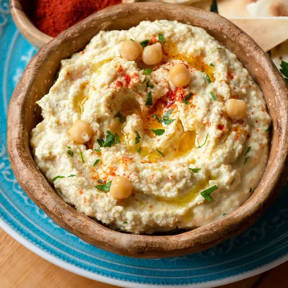 Creamy and savory hummus cooked in an electric pressure cooker. A very delicious, easy, and healthy spread. #pressurecooker #instantpot #dip #appetizers #hummus #homemade #dinner #vegetarian #vegan