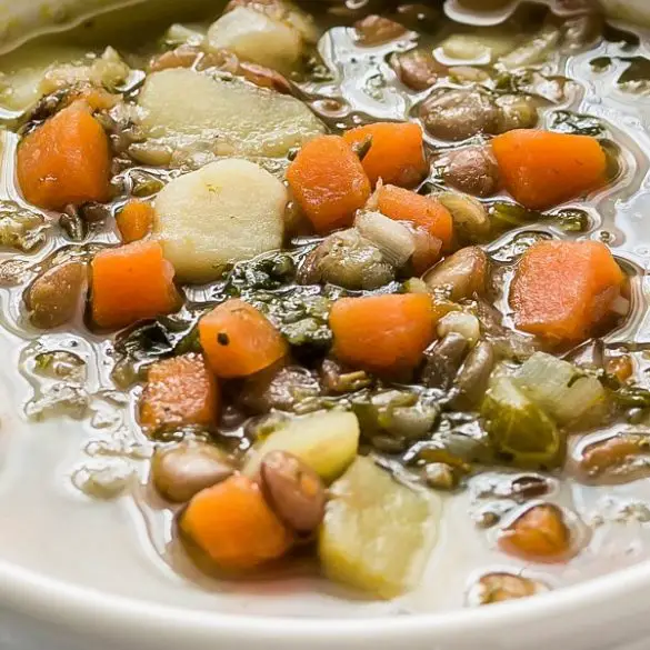 Instant pot healthy lentil and spinach soup. Golden lentils with spinach, vegetables, and spices cooked in an electric instant pot. Easy and healthy! #pressurecooker #instantpot #healthy #vegetarian #vegan #soup