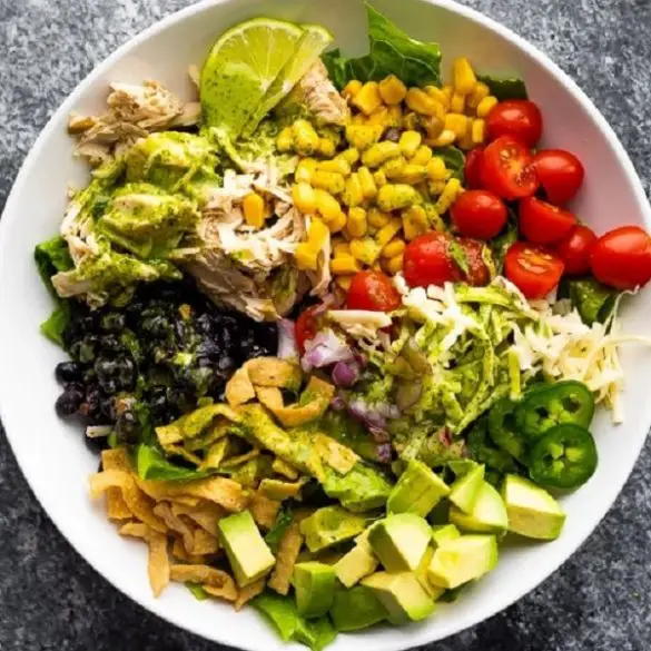 Slow cooker beef chicken taco salad recipe. Chicken breasts with beer and spices cooked in a slow cooker and served with yummy homemade Cilantro Vinaigrette. #slowcooker #crockpot #chicken #dinner #taco #beer #mexican #homemade