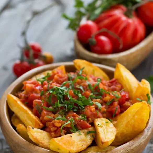 Air fryer Spanish spicy potatoes recipe. These spacy potatoes are ideal for the next time you want to cook Spanish cuisine. They're not only versatile but super easy to make. #airfryer #vegetarian #vegan #potatoes #dinner #healthy