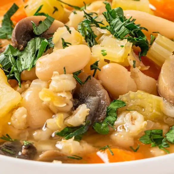 Slow cooker bean and barley soup recipe. A hearty soup that will warm your soul on a cold winter day. #slowcooker #crockpot #homemade #soups #dinner #hearty