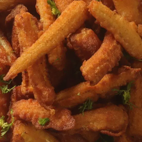 Air fryer crispy baby corn recipe. Fried crisp and spicy baby corn, coated with sriracha, ketchup and Panko breadcrumbs is the perfect quick and healthy snack in your air fryer. #airfryer #crispy #dinner #appetizers #party #vegetarian #vegan #homemade #corn