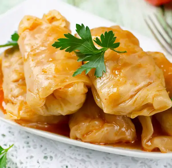 Delicious and easy stuffed cabbage rolls recipe. A complete meal in one pot. This hearty dish is packed with flavor and will pass the taste test with all your family members! #instantpot #pressurecooker #cabbage #healthy #dinner #homemade #recipes