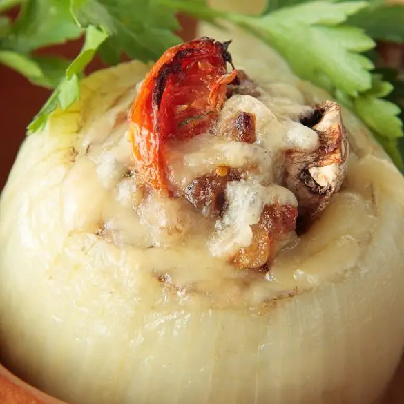 Slow Cooker stuffed onions recipe. Get cozy by the fire this winter with a batch of these slow cooker stuffed onions. It's a great appetizer that's even better as leftovers. #slowcooker #crockpot #recipes #appetizers #dinner #homemade #healthy #easy #yummy #delicious